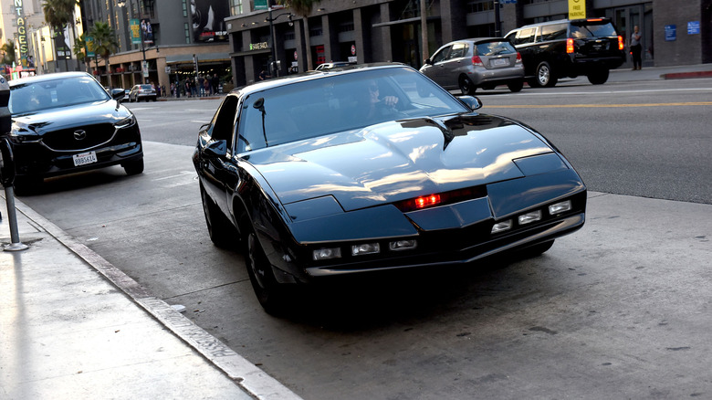 a pontiac firebird trans am parked on the street