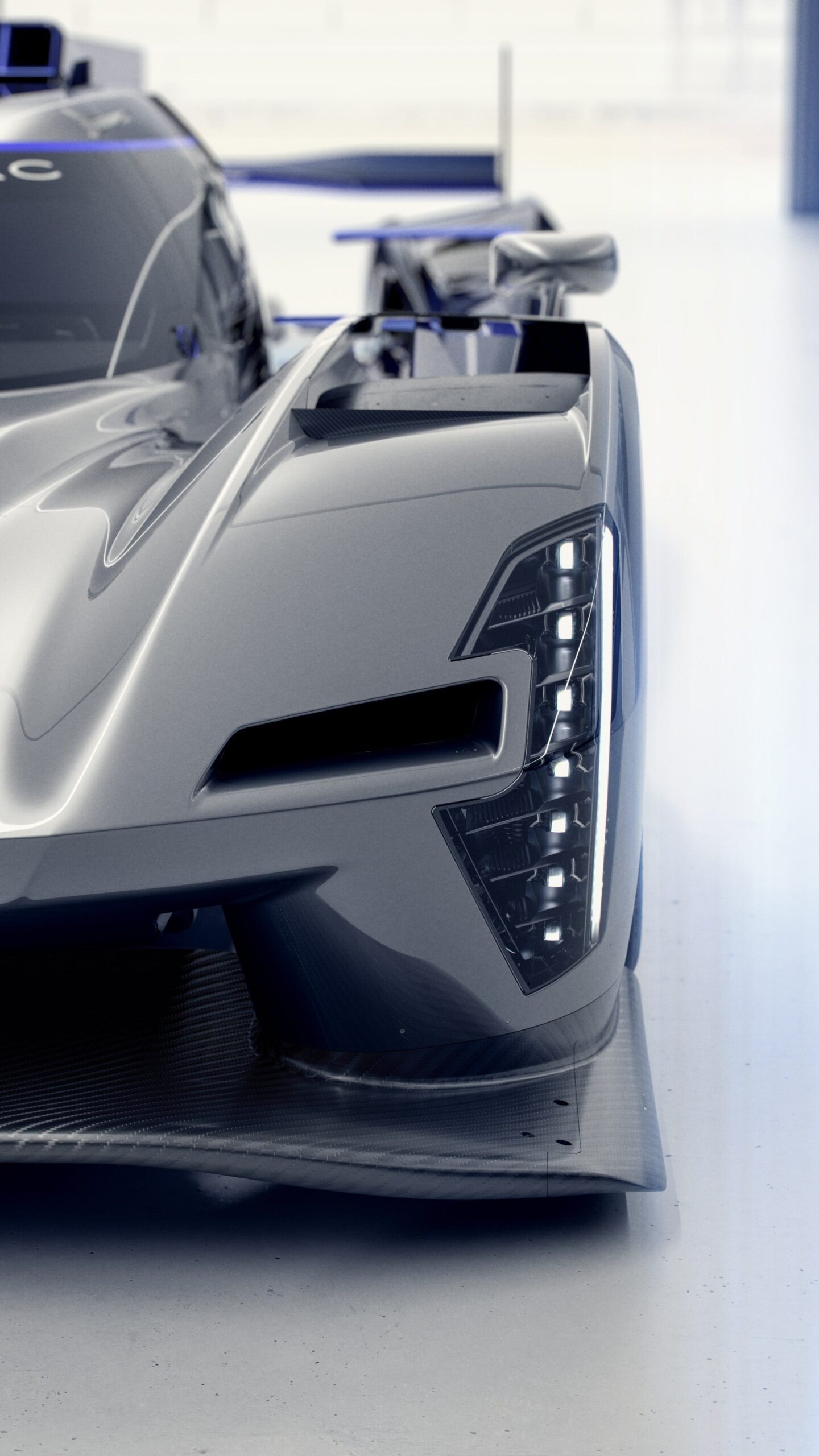 Close-up of a sleek, futuristic racing car with distinctive headlights and aerodynamic design. Close-up of a sleek, futuristic racing car with distinctive headlights and aerodynamic design.