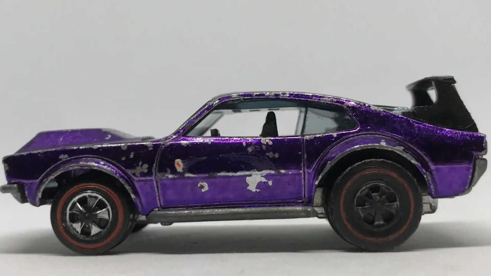 1970 Hot Wheels Mighty Maverick side facing left purple