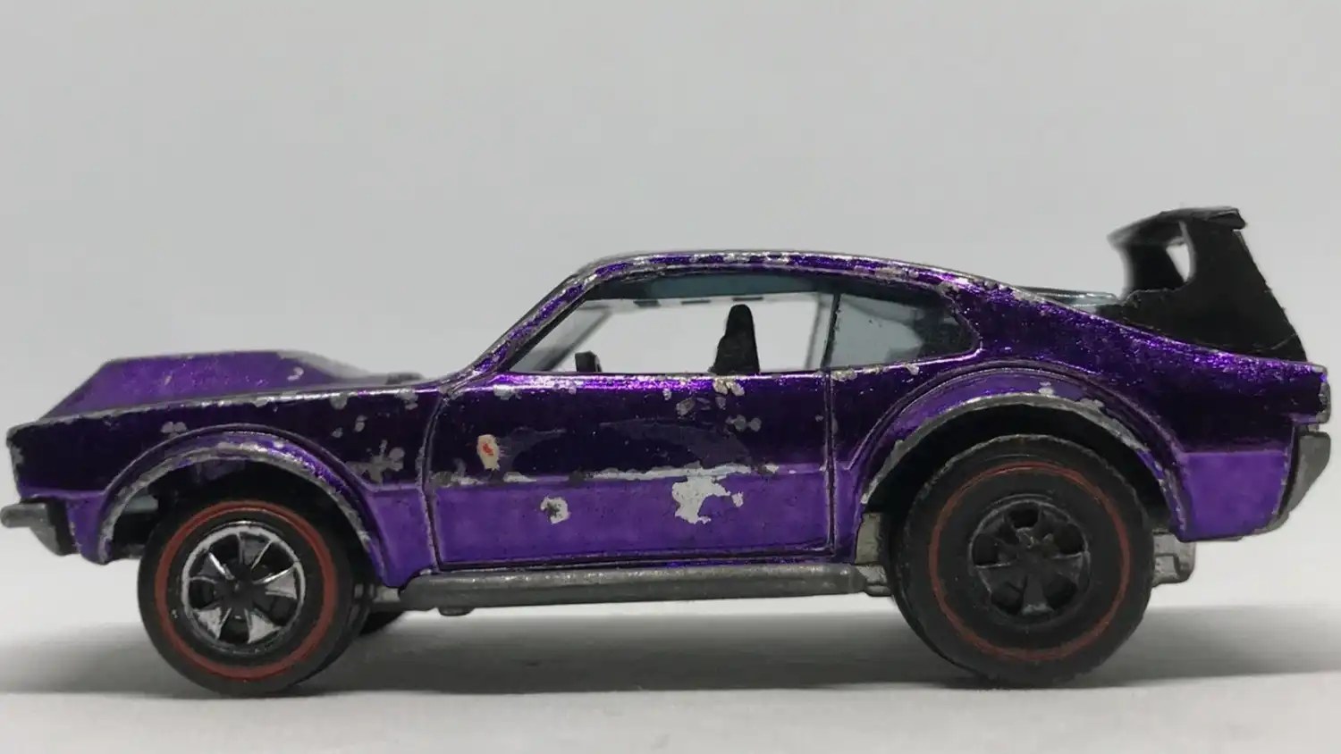 1970 Hot Wheels Mighty Maverick side facing left purple