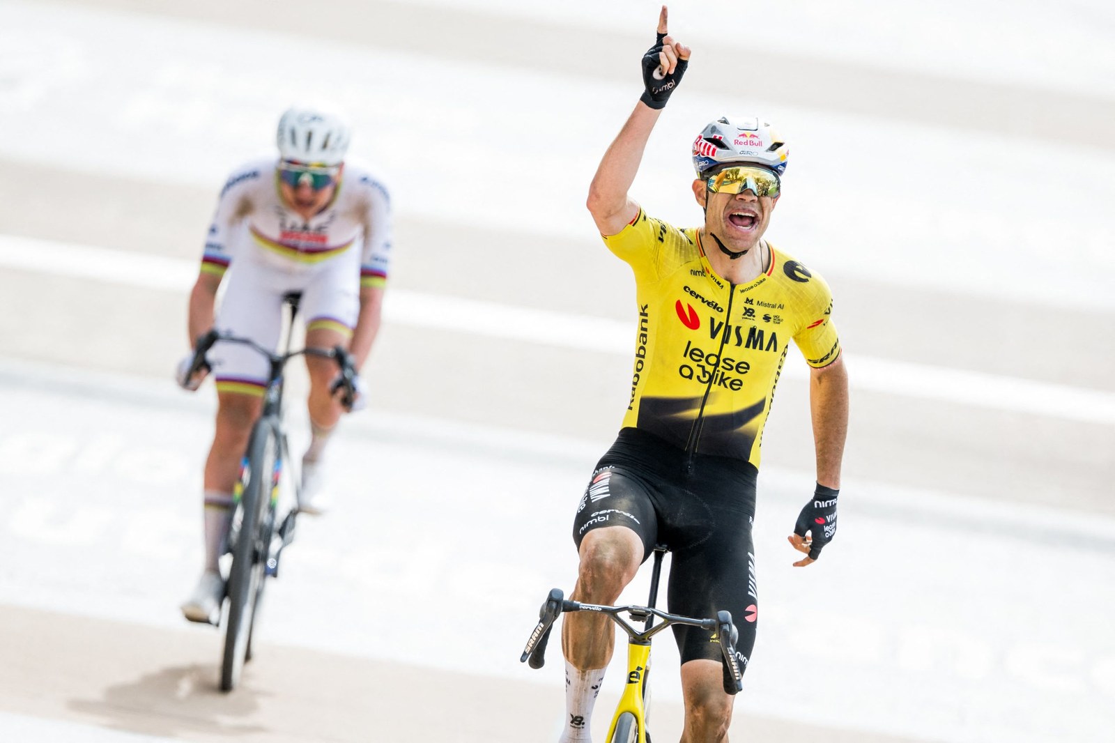 Belgian Wout van Aert of Team Visma-Lease a Bike celebrates as he crosses the finish line to win the men's Paris-Roubaix cycling race, Sunday 12 April 2026, around Roubaix, France. The 123rd edition of Paris-Roubaix cycling races will take on Sunday, with the women riding 143,1 km the men riding 258,3 km on Sunday. BELGA PHOTO JASPER JACOBS (Photo by JASPER JACOBS / BELGA MAG / Belga / AFP via Getty Images)