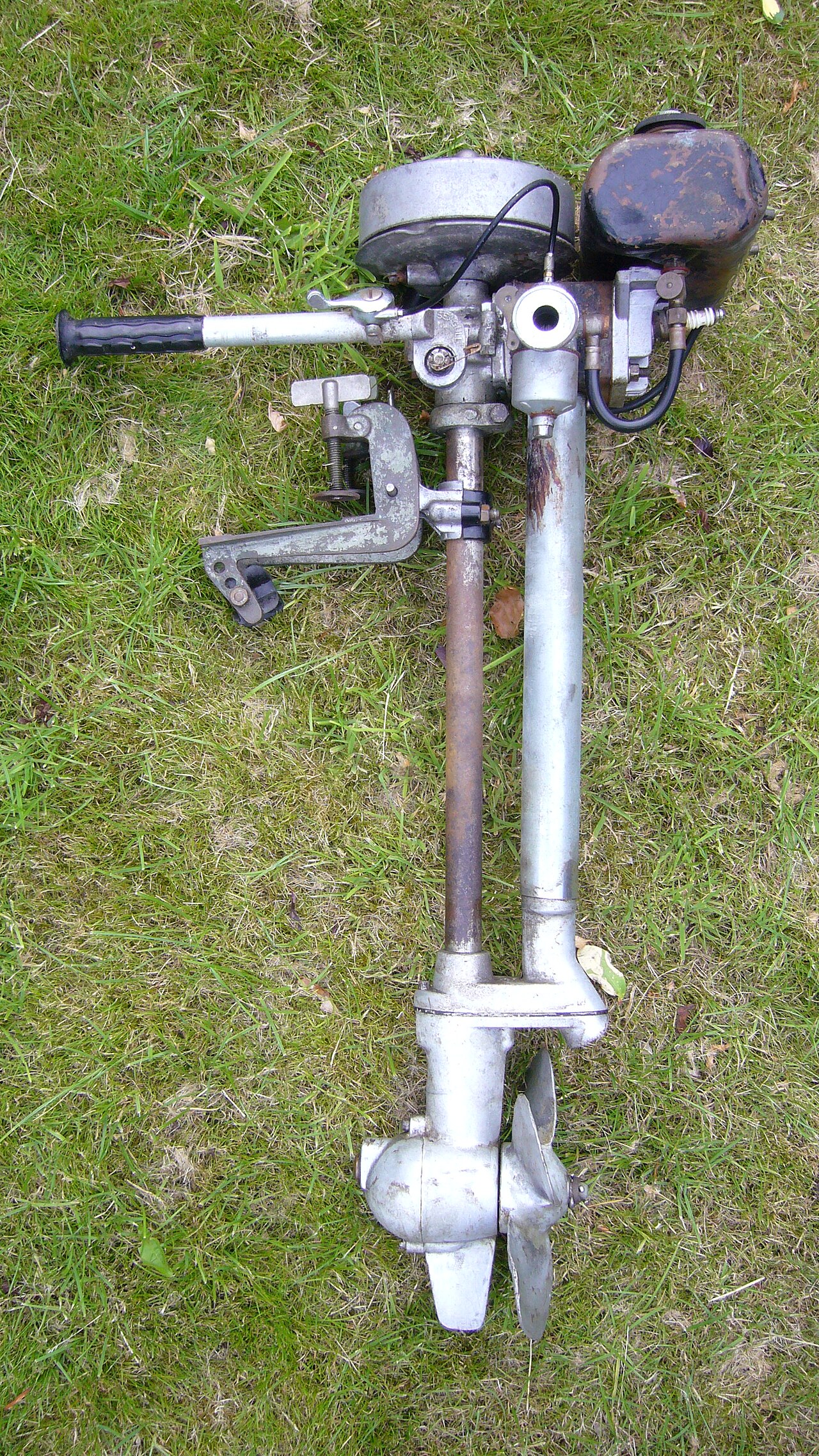 Lateral view of a two-stroke Forty series British Seagull outboard engine; the serial number dates it to 1954/1955