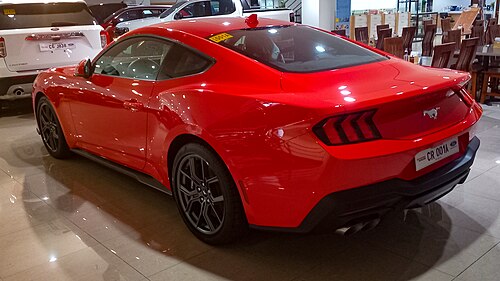 2024 Ford Mustang 2.3 EcoBoost in Race Red, rear left, 06-26-2024