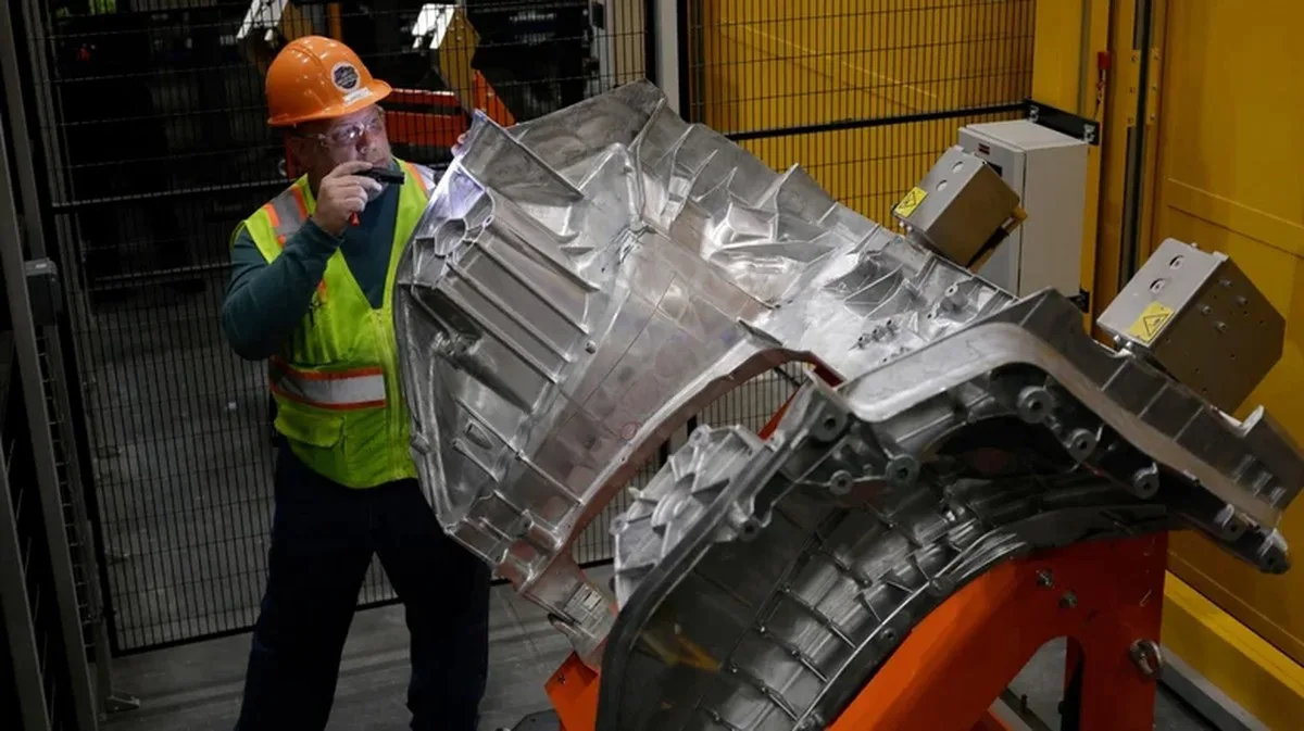 Ford worker inspecting aluminium unicasting for a Ford Fathom truck