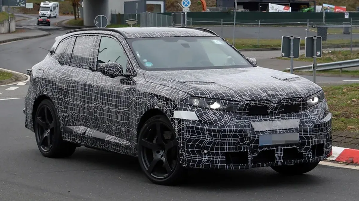 A camouflaged prototype of the next BMW X5 M during testing in Germany.