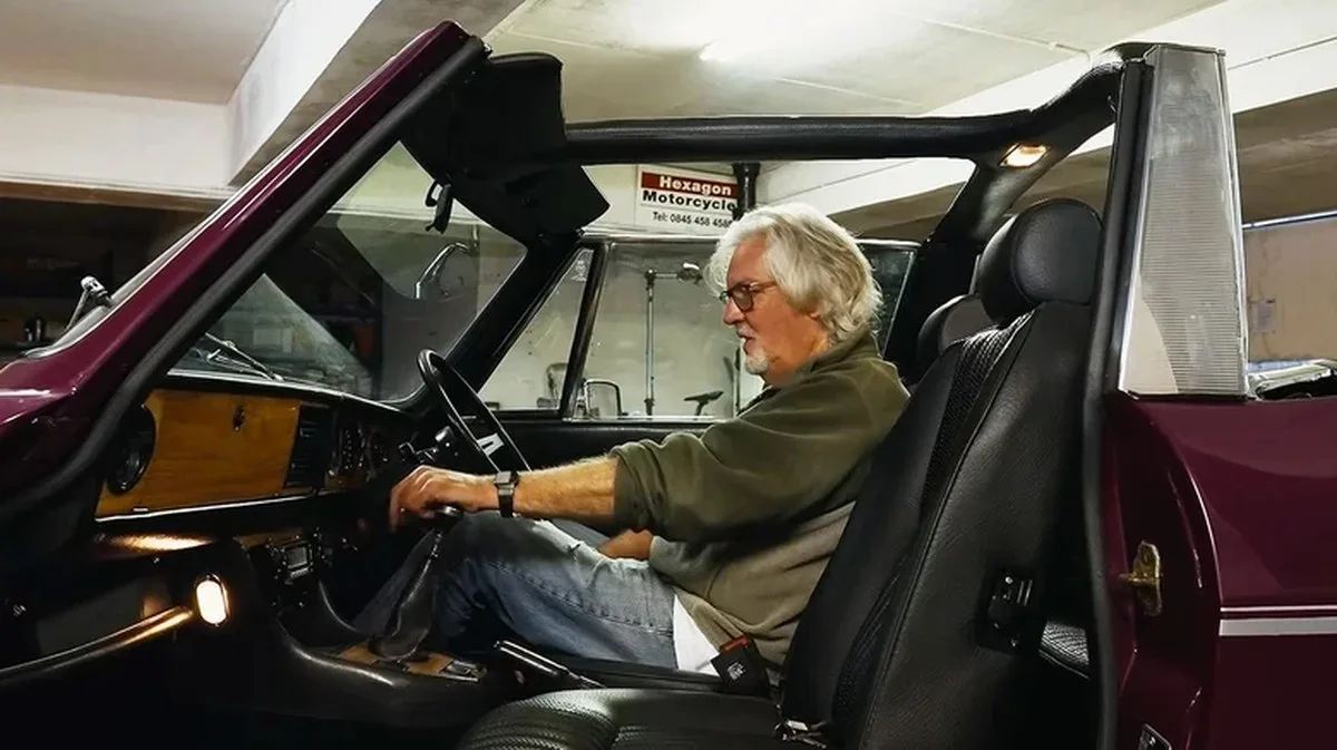James May sitting inside his 1974 Triumph Stag