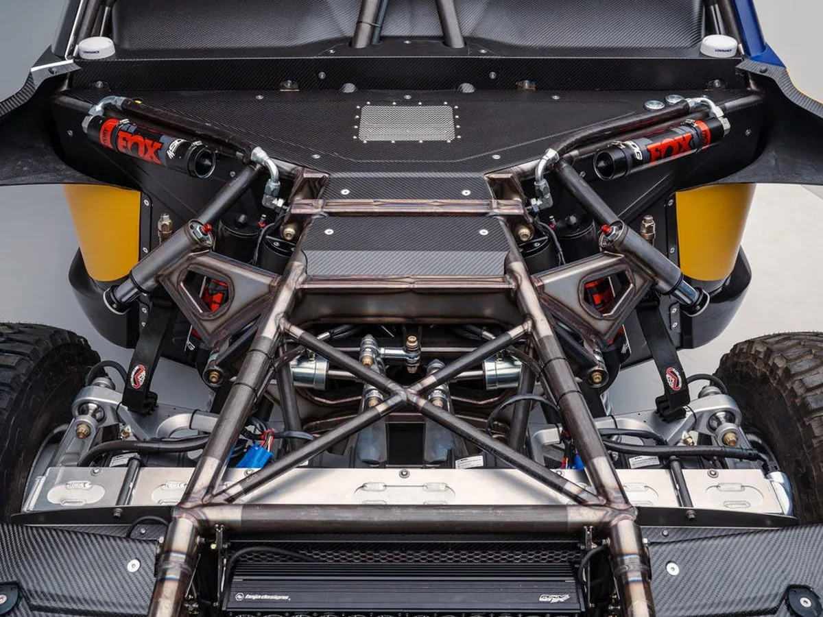 Detailed view of a vehicle's suspension system showcasing metal framework and shock absorbers.