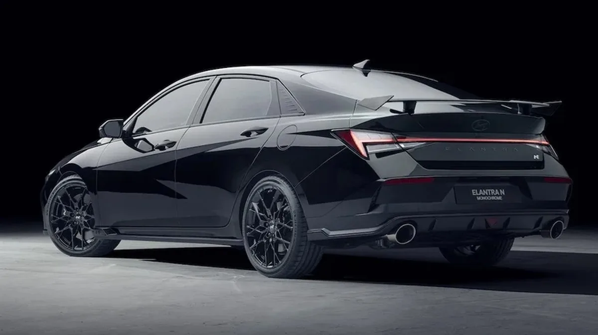 Rear 3/4 of a black Hyundai Elantra N Monochrome.