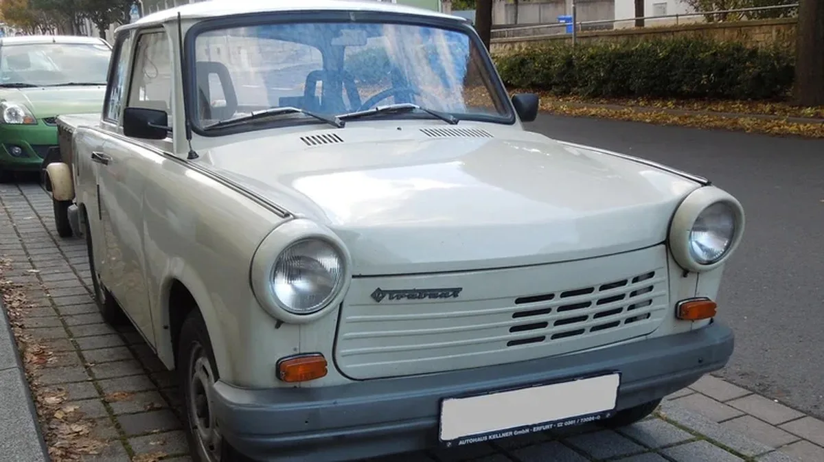 A Trabant 1.1 with a four-cylinder engine parked on a street.