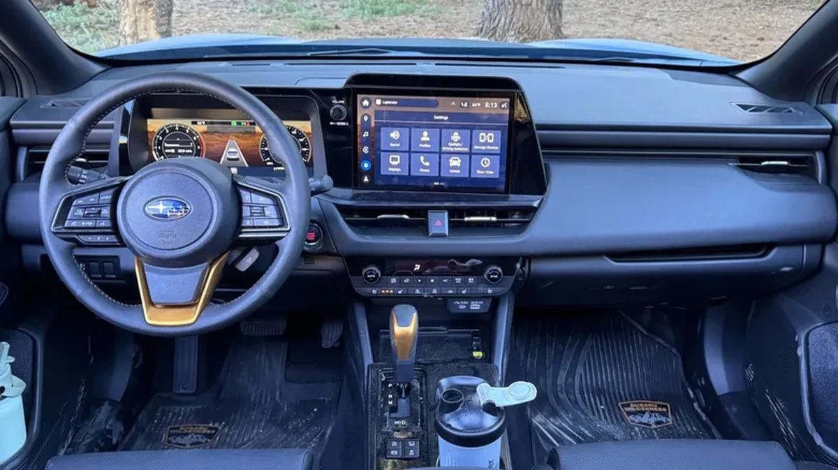 wide shot of the dashboard in the black interior of an Outback Wilderness w