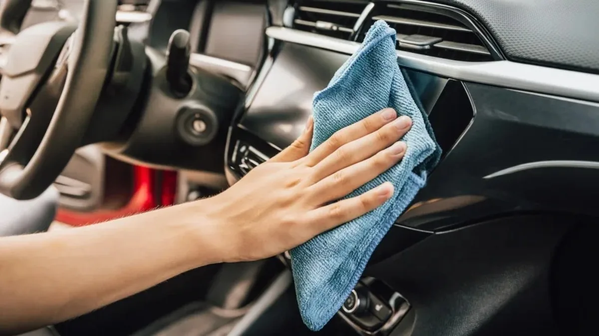 Microfiber towels being used to clean a car's interior