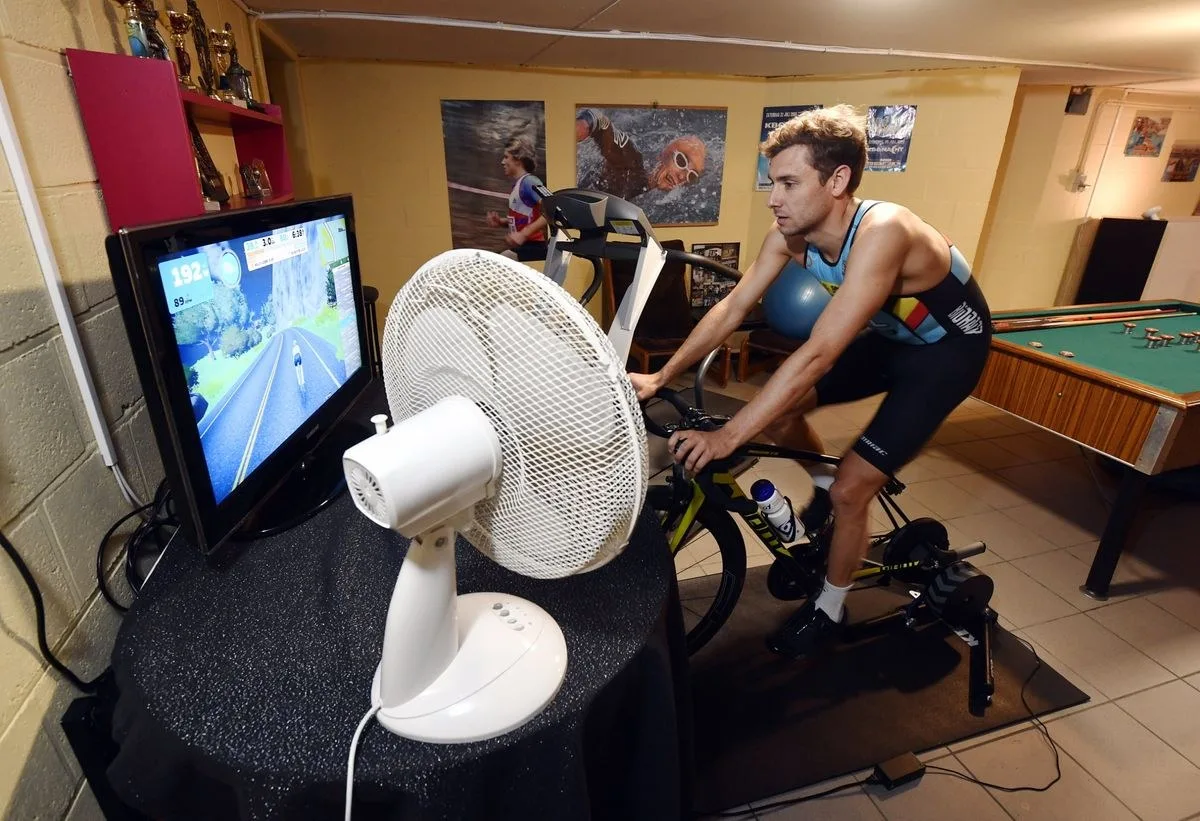 Belgian triathlete Jelle Geens training indoors on a smart trainer