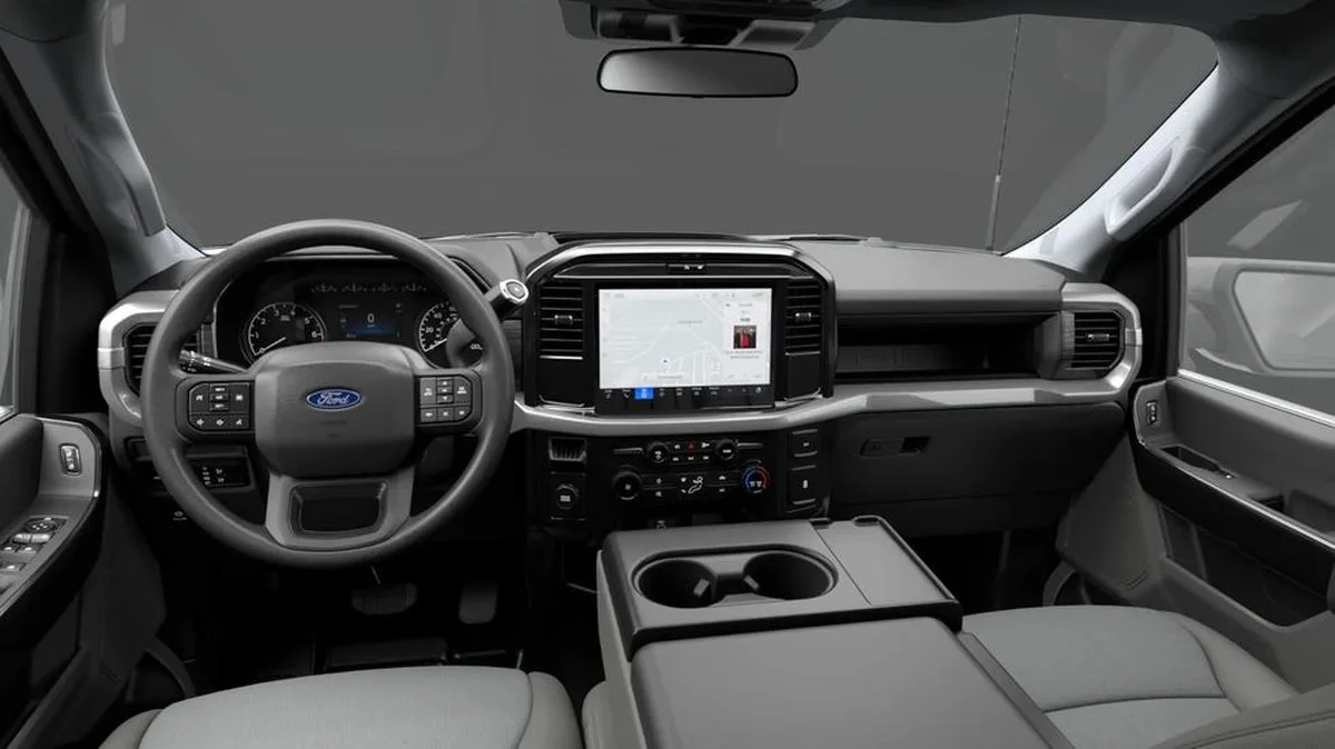 Interior view of a Ford vehicle featuring a steering wheel, digital dashboard, and touchscreen display. Interior view of a Ford vehicle featuring a steering wheel, digital dashboard, and touchscreen display.