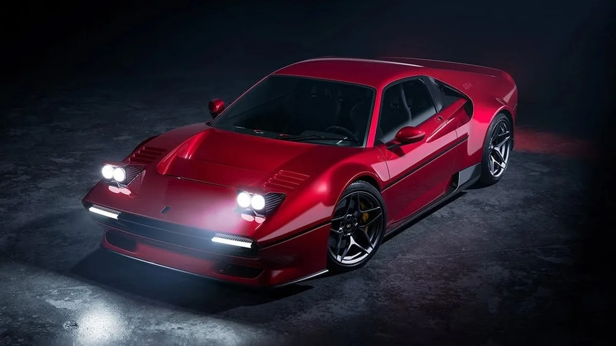 Sleek red sports car with prominent headlights parked in a dimly lit environment.