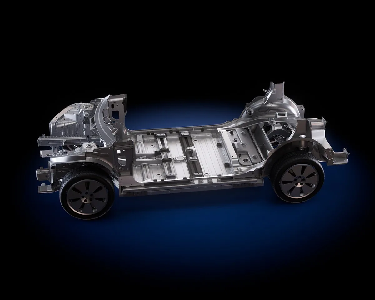 Automotive chassis model showcasing an intricate metallic structure with wheels. Automotive chassis model showcasing an intricate metallic structure with wheels.