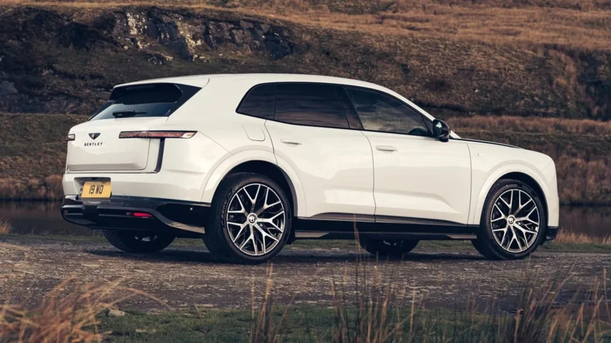 The rear three-quarter of a white Bentley Torcal